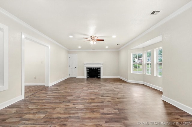 unfurnished living room with ornamental molding and dark hardwood / wood-style flooring