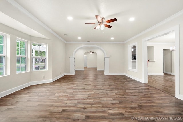 unfurnished living room featuring hardwood / wood-style flooring, ceiling fan, and crown molding