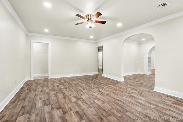 empty room with crown molding, ceiling fan, and light hardwood / wood-style flooring