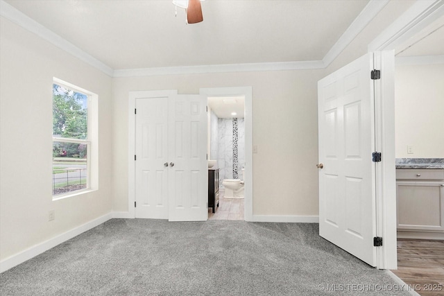 unfurnished bedroom with light carpet, connected bathroom, crown molding, and ceiling fan