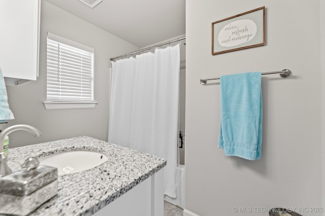 bathroom featuring shower / tub combo with curtain and vanity