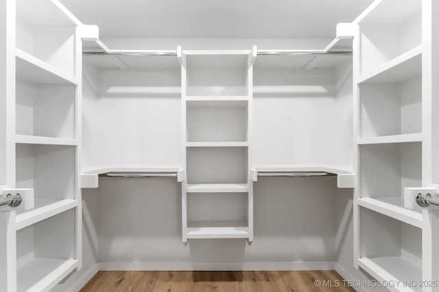 203 W Monroe Ave, Mcalester, OK 74501 - spacious closet with wood finished floors