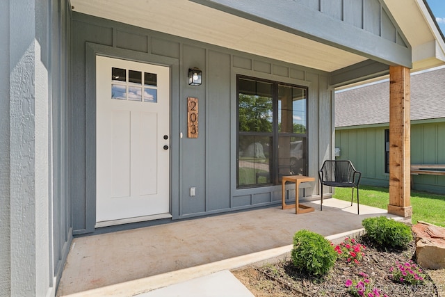 203 W Monroe Ave, Mcalester, OK 74501 - entrance to property with a porch and board and batten siding