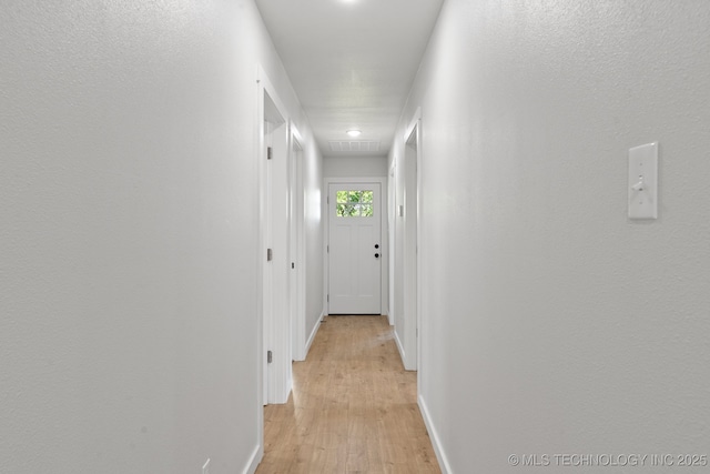 203 W Monroe Ave, Mcalester, OK 74501 - hall featuring light wood-style flooring and baseboards