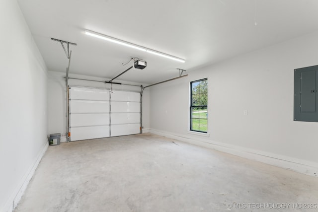 203 W Monroe Ave, Mcalester, OK 74501 - garage featuring electric panel and a garage door opener