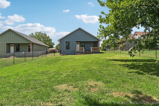 203 W Monroe Ave, Mcalester, OK 74501 - rear view of property with board and batten siding and a porch