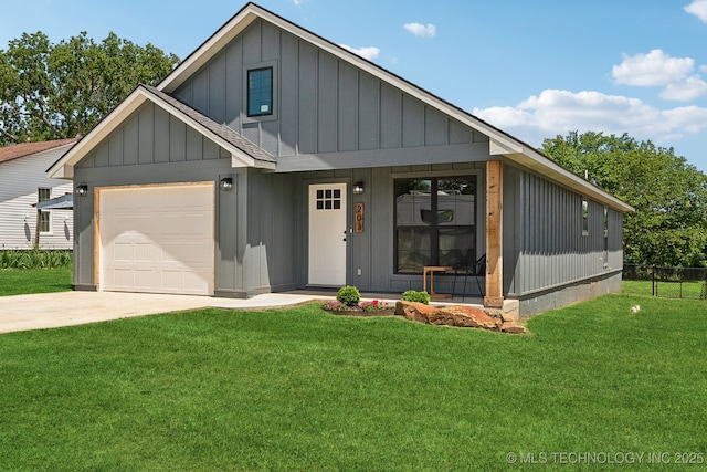 203 W Monroe Ave, Mcalester, OK 74501 - view of front of house with board and batten siding, an attached garage, and concrete driveway