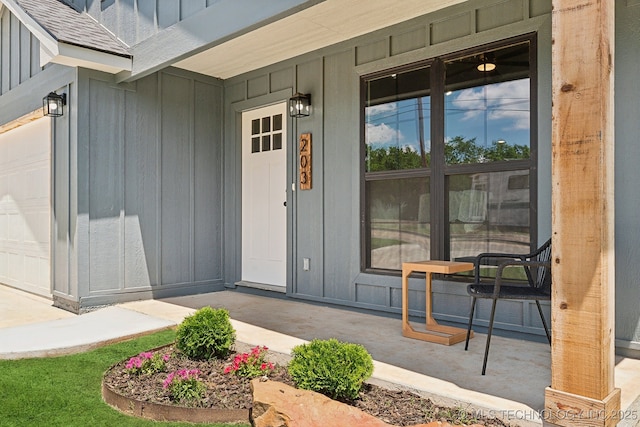 203 W Monroe Ave, Mcalester, OK 74501 - entrance to property featuring board and batten siding and covered porch