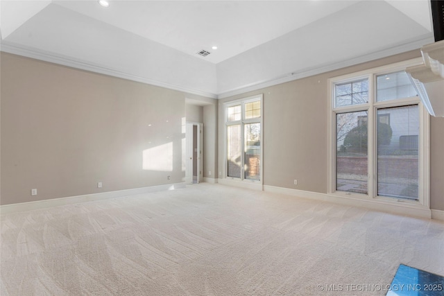 unfurnished room with a towering ceiling and light colored carpet