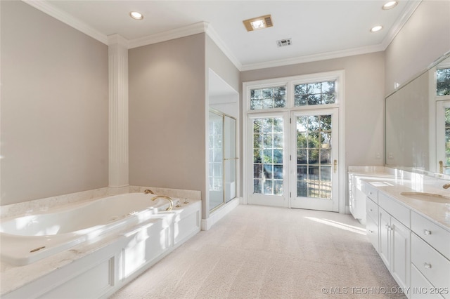 bathroom with ornamental molding, vanity, and plus walk in shower