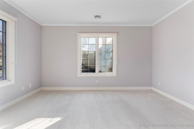 unfurnished room with crown molding