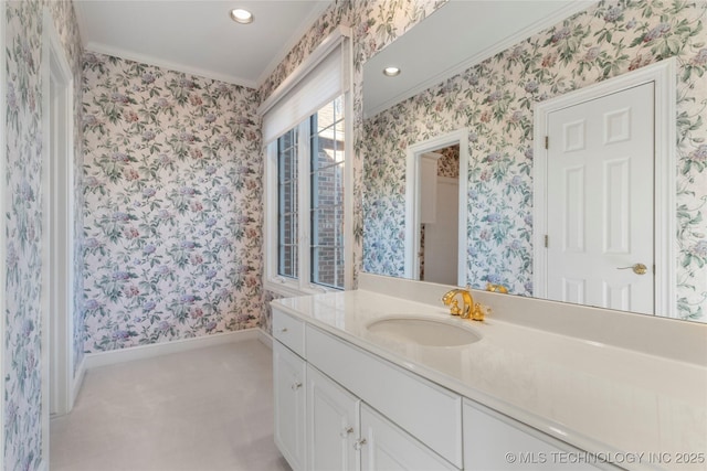 bathroom with ornamental molding and vanity