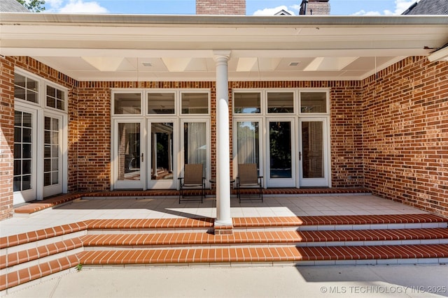 view of exterior entry featuring french doors