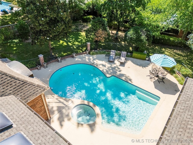 view of swimming pool featuring an in ground hot tub and a patio