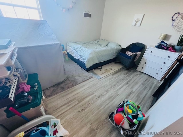 bedroom featuring light hardwood / wood-style floors