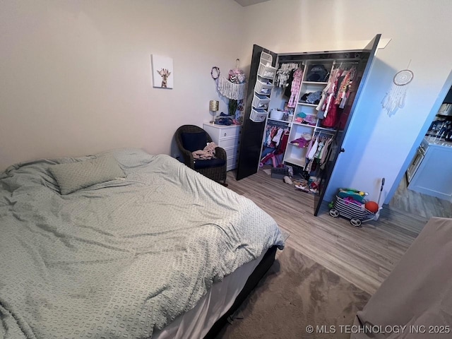 bedroom featuring hardwood / wood-style flooring