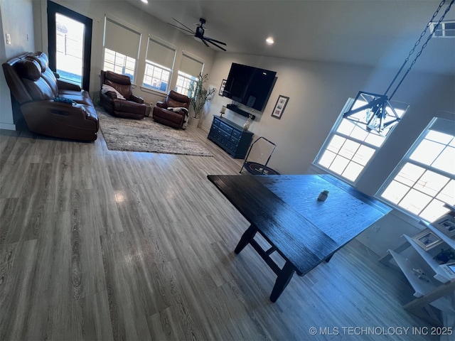 living room with hardwood / wood-style floors and ceiling fan