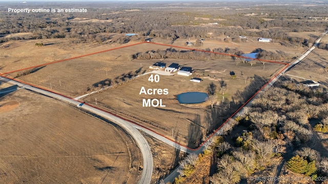 birds eye view of property featuring a rural view