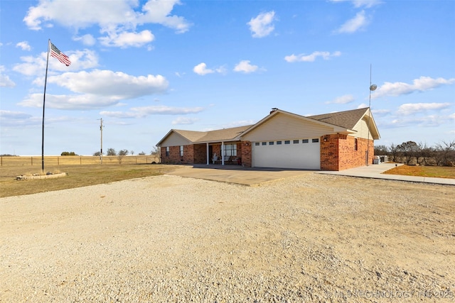 ranch-style home featuring a garage