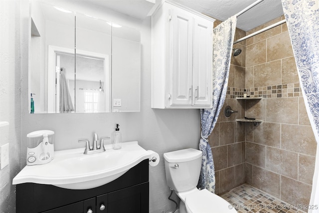 bathroom featuring vanity, a shower with curtain, and toilet