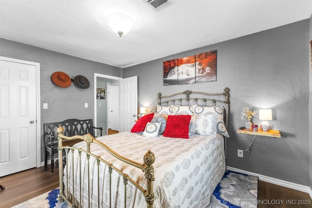 bedroom featuring dark wood-type flooring