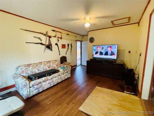 living room featuring ornamental molding and dark hardwood / wood-style flooring