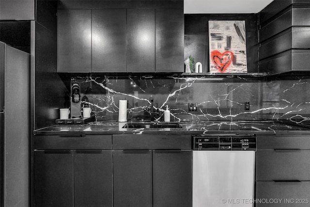 kitchen with sink, decorative backsplash, and appliances with stainless steel finishes