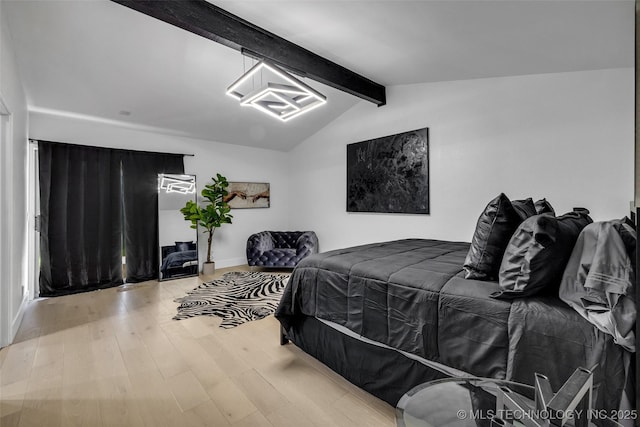 bedroom with lofted ceiling with beams and light wood-type flooring