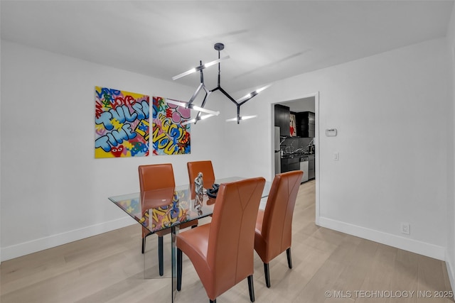 dining area with light hardwood / wood-style floors