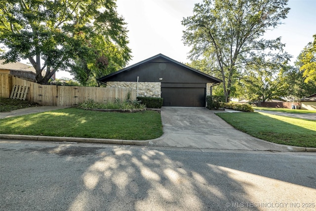 view of side of home with a garage and a yard