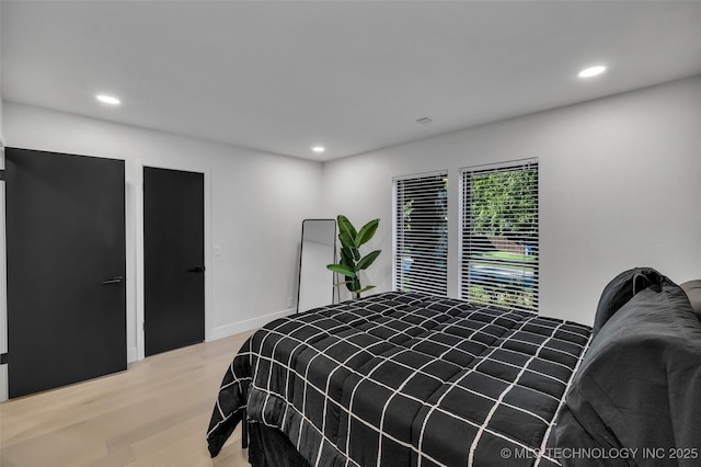 bedroom featuring wood-type flooring