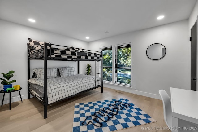 bedroom featuring wood-type flooring