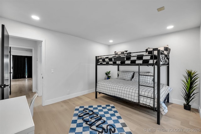 bedroom with light wood-type flooring