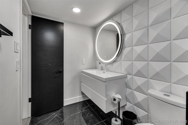 bathroom with vanity and toilet