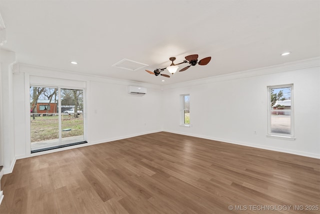 unfurnished room featuring crown molding, a wealth of natural light, and light hardwood / wood-style floors