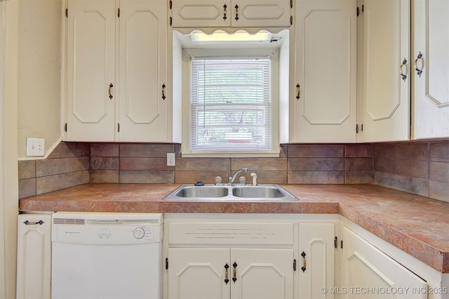 kitchen with white dishwasher, sink, and decorative backsplash