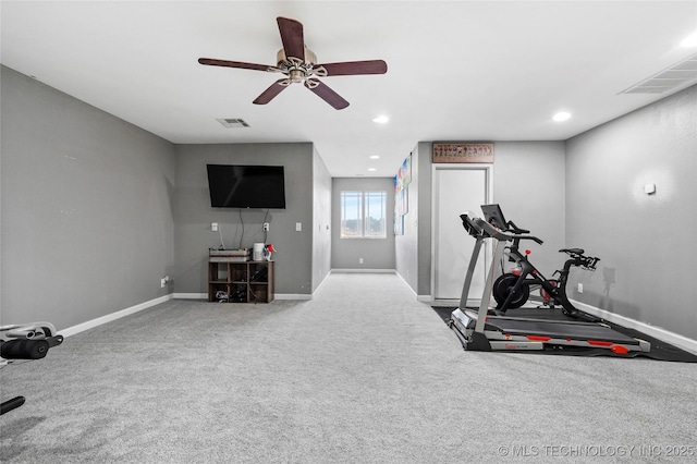 workout area featuring carpet and ceiling fan