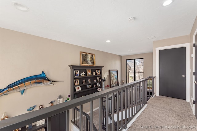 hallway with carpet flooring