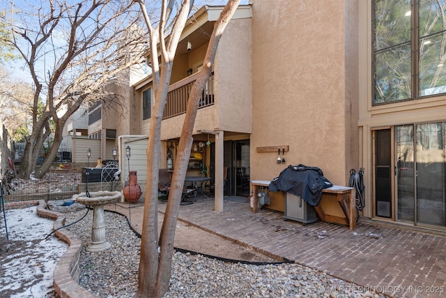 rear view of house with a patio