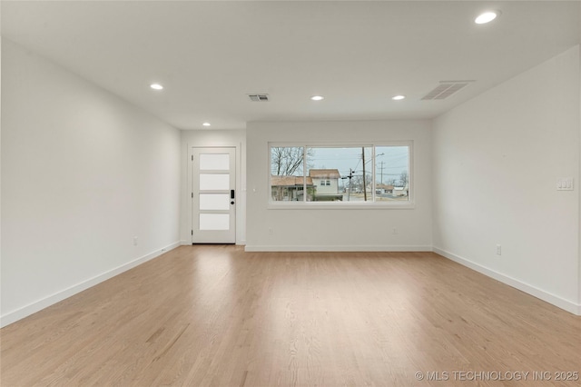 unfurnished living room featuring light hardwood / wood-style flooring