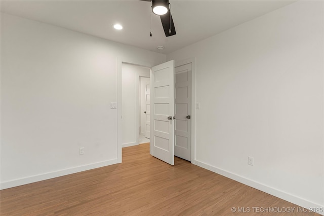 unfurnished bedroom featuring light hardwood / wood-style flooring and ceiling fan