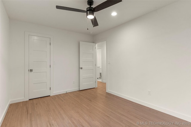 unfurnished bedroom featuring ceiling fan and light wood-type flooring