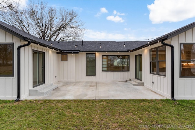 back of house with a yard and a patio area