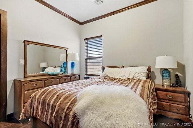 bedroom with ornamental molding