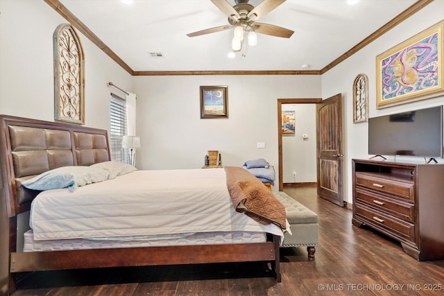 bedroom featuring crown molding, dark wood-type flooring, and ceiling fan