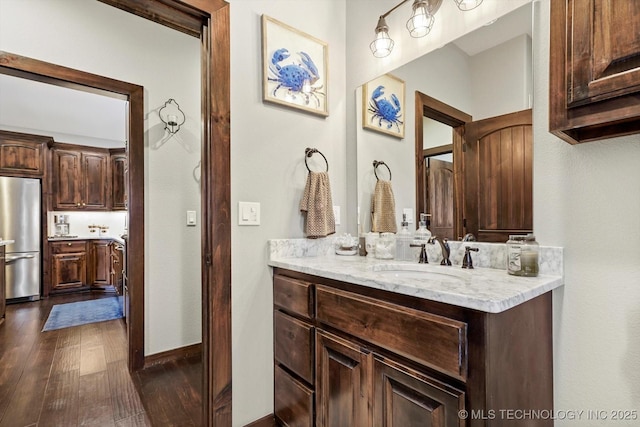 bathroom featuring hardwood / wood-style flooring and vanity