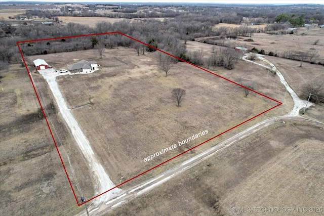 birds eye view of property with a rural view