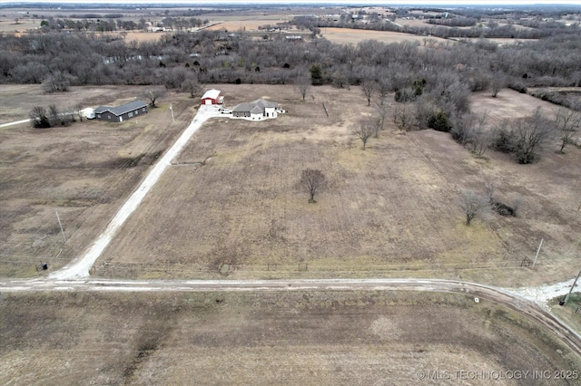 birds eye view of property featuring a rural view