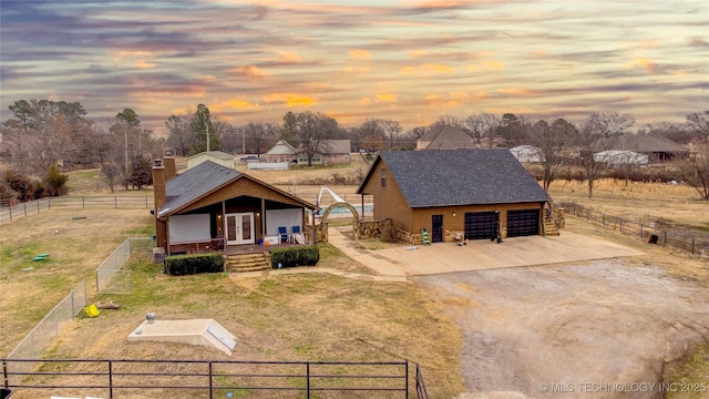 view of front of house featuring a garage and covered porch