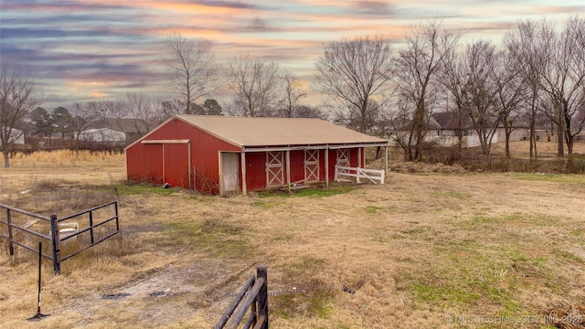 outdoor structure at dusk with a rural view